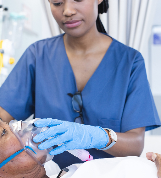 Nurse putting mask on patient