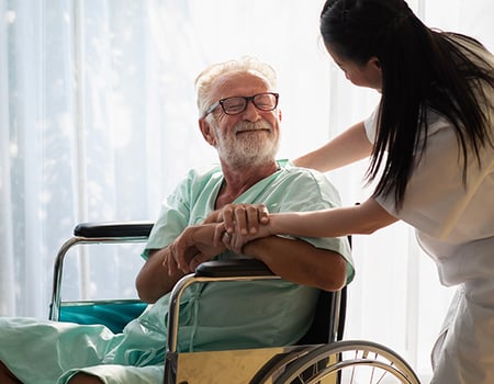 senior patient in a wheelchair with nurse