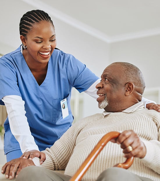 patient and nurse smiling at each other