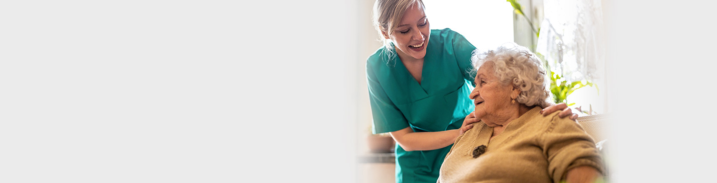 Nurse and senior patient smiling