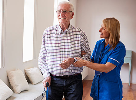 Nurse walking senior patient