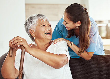 nurse comforting elderly patient