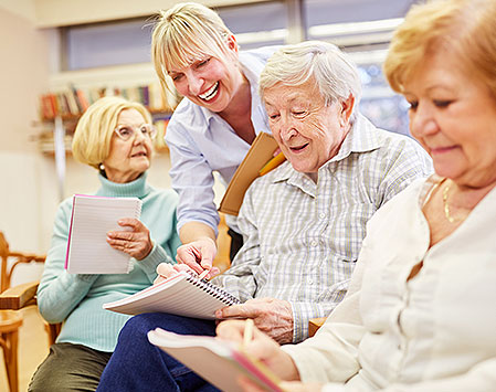 seniors in workshop talking with instructor