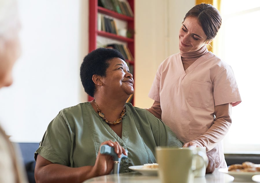 Nurse checking on patient during lunch